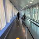 These yellow dots on the floor are the most visible indicator at JFK that there is pandemic going on.
